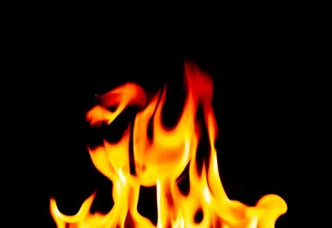 Defocused Burning Flames on a Black Background Stock Photos