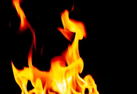 Defocused Burning Flames on a Black Background Stock Photos