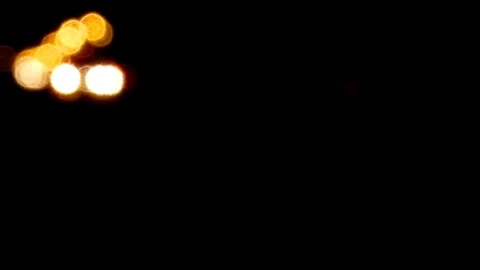 Defocused bus blur background. Moving bokeh circles of night traffic. Stock Footage 82807792