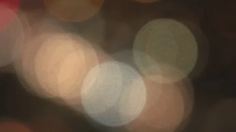 Defocused Car Lights Creating Abstract Bokeh at Night Stock Footage 342589019