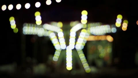 Defocused carousel with lights at night Stock Footage 229499235