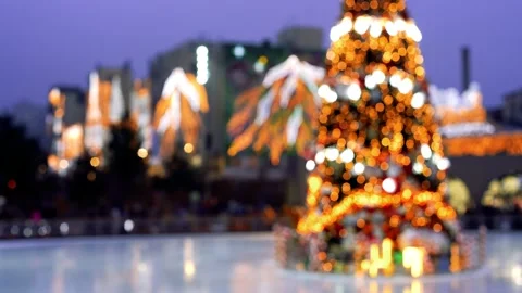 Defocused Christmas tree in bokeh effect blinking on ice rink. Stock Footage 145491114