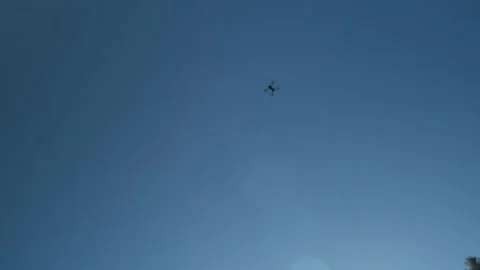 Defocused cinematic shot of drone flying in the blue sky. Stock-Footage 291362809