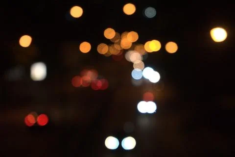 Defocused cirular geometry abstract background. City night light bokeh vint.. Stock Photos