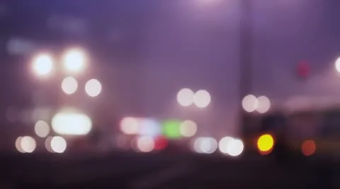 Defocused city lights at intersection Stock Footage 10315476