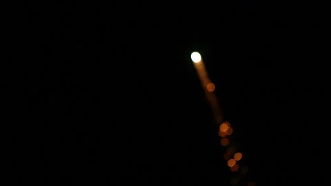 Defocused close up slow motion fireworks with tail Video stock 235218141