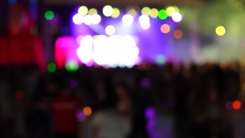 Defocused colored lights on stage. Party, disco, blurry lights and silhouette 스톡 동영상 170745764
