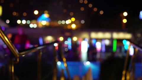 Defocused colored lights on stage. Party, disco, blurry lights and silhouette Stock Footage 198415796