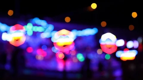 Defocused colorful blinking lights of a carousel ride Stock Footage 122512536