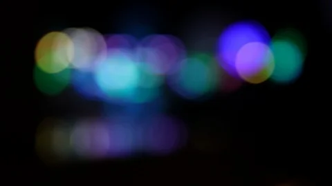 Defocused colorful blinking lights of moving carousel at night Stock Footage 123071208