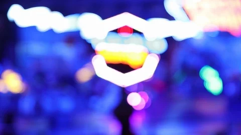 Defocused colorful blinking lights on moving carousel ride Stock Footage 123071466