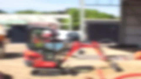 Defocused construction site with partially constructed buildings and diggers Stock Footage 169101590