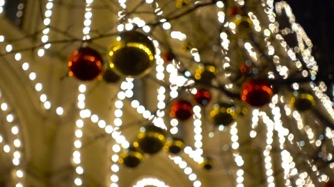 Defocused decorated trees and the house illumination in the Christmas city Stock Footage 88501566