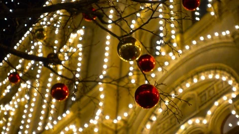 Defocused decorated trees and the house illimination in the Christmas town Stock Footage 88503045