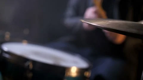 Defocused drummer behind drum set in record studio Stock Footage 114995793