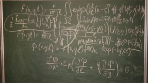 Defocused equations in optics on blackboard in classroom. Stock Footage 69988397