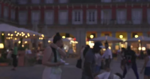 Defocused evening crowd with outdoor cafes in Plaza Mayor Stock Footage 338338311