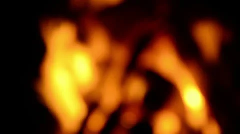 Defocused fire of a campfire with red and orange ember flickering Stockbeeldmateriaal 23599591