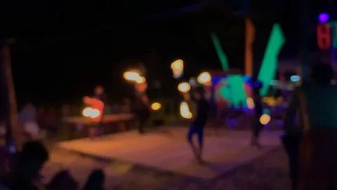 Defocused fire performance. blurred people performers spinning burning flames at 스톡 동영상 129111499