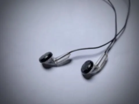 Defocused flat lay earphone concept, negative space. Фото