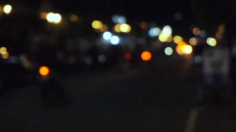 Defocused footage of traffic in the night. Congested city traffic at rush Stock Footage 204890642