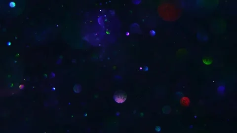 Defocused Glitter: Shiny Blue, Silver, and Black Oil Bubble Texture Ink Mix Stock Footage 240539121