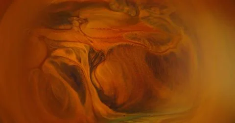 Defocused glitter wave orange paint splatter water Stock-Fotos