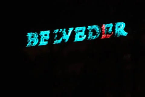 Defocused glowing text on night time Stock Photos