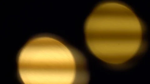 Defocused golden circles light effects, abstract blurred motion boche background Stock Footage 93403163