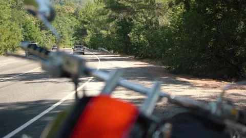 Defocused handlebar and small mirrors of large motorcycle Stock Footage 143308546