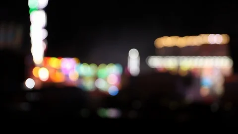 Defocused illuminated carnival at night with blinking attractions Stock Footage 120527071