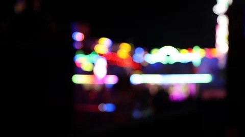 Defocused illuminated fairground with blinking lights Stock Footage 120527105