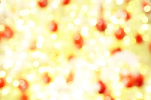 Defocused image of christmas light background, red and yellow. Stock Photos