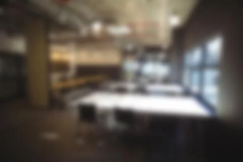Defocused image of empty tables in office cafeteria Stock Photos