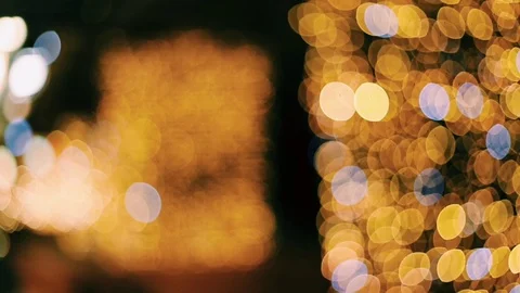 Defocused image of illuminated lights at night Stock Footage 99499392