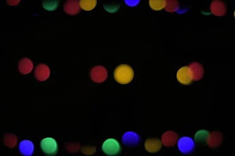 Defocused light of multi-colored light bulbs at night, bokeh Foto stock