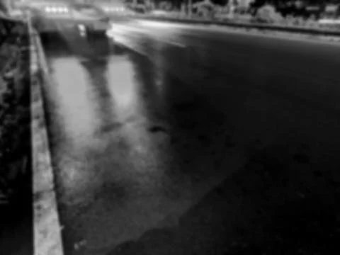 Defocused light reflections on asphalt Stockfoto's