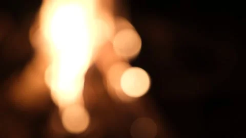 Defocused the light of yellow bonfire in dark blurred background Stock Footage 143696015