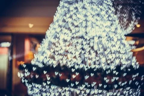 Defocused lights background. Heart bokeh Stock Photos