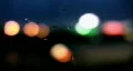 Defocused lights. Wet car window. HD Footage