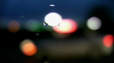 Defocused lights. Wet car window. Stock Footage