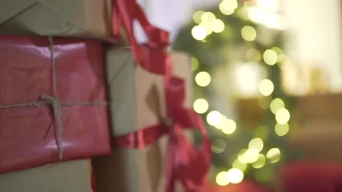 Defocused marvelous view on wrapped Christmas gifts presents pile in New Year tr Stock Footage 132676884