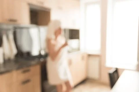 Defocused modern light kitchen. Stock Photos