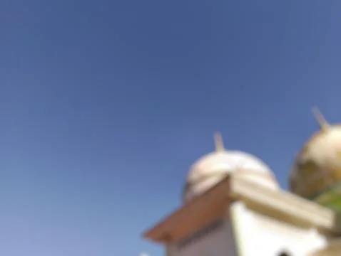 Defocused Mosque Domes Under Clear Blue Sky in Sunny Day Islamic Architecture Stock Photos