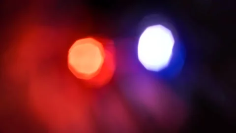Defocused motion. Bright blue and red flashes in night. Stock Footage 147250218