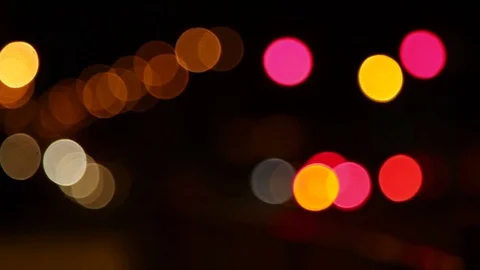 Defocused multicolored light flashlight blurry abstract on black background Stock Footage 74290736