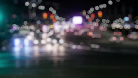 Defocused Night Intersection with Car Movement Stock Footage 335688049