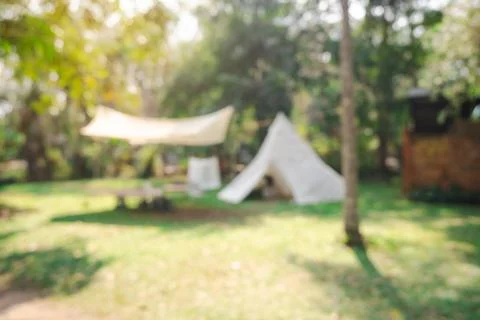 Defocused or blur with bokeh background of garden trees in sunny day Stock Photos