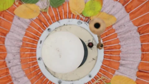 Defocused Orange Ceiling Fan Decorated with Artificial Autumn Leaves Stock Footage 334120712