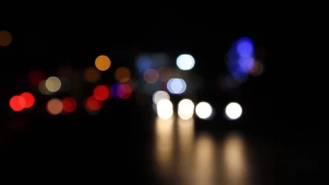 Defocused, Out of focus colorful bokeh lights of the moving traffic at night Stock Footage 108251553